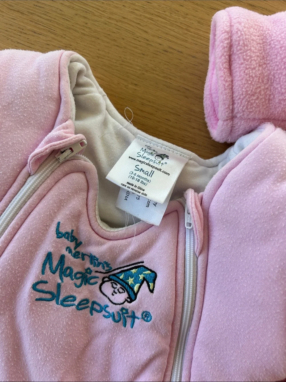 2 pink magic Merlin sleep suits size small 3-6m